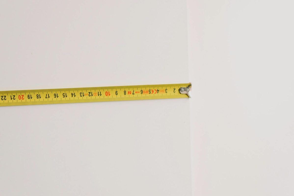 Customizable Furniture: How to Tailor Pieces to Your Space 7 measuring tape on empty white background