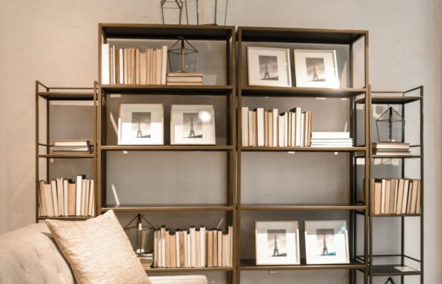 brown wooden shelf and beige fabric sofa