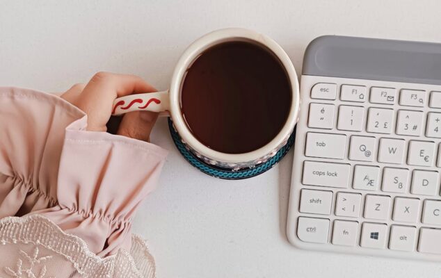 woman enjoying coffee at modern workspace
